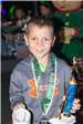 Young Boy Holding a Mug and Trophy