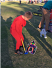 Child playing mini-golf